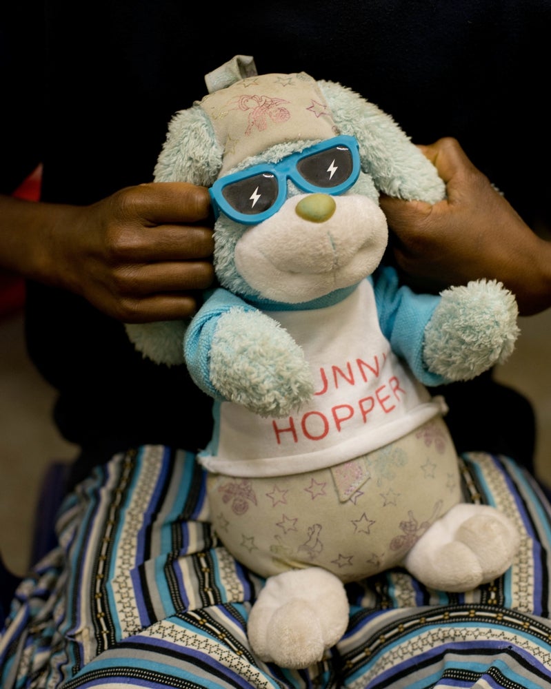 A 13-year-old girl sits in the child protection room at the Family Support Center in Tari, Papua New Guinea.