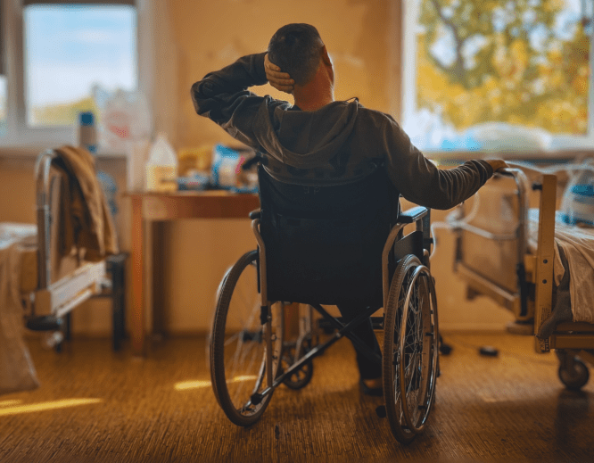 A wounded man in a wheelchair in Ukraine.