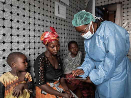 A doctor screens patients for mpox in DR Congo.