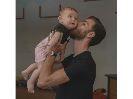 A Syrian refugee holds a baby in Lebanon.